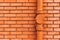 Gutter downpipe and brick wall