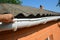 Guttering repair with contractor hands. Asbestos roof gutter repair