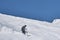 A guy on alpine skiing descends the snowy slope of Cheget mountain