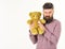 Guy with beard does not like to share soft toy.