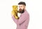 Guy with beard does not like to share soft toy.