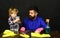 Guy with beard at table with cleaning supplies on.