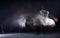 Guy breakdancer dancing hip-hop on the floor in studio on black background. Dance school poster. Long exposure shot