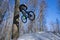Guy does a bike trick in the winter. Man shows Moto whip trick on a bicycle.