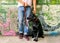 Guy with a dog labrador on the street playing