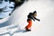 Guy with dreadlocks riding down on the mountain