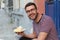 Guy enjoying a waffle with vanilla ice cream