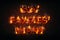 Guy Fawkes' Night greeting card or poster with flaming fiery text on dark background