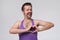 Guy with funny mustache making heart shape with his hands in fitness sportwear