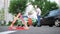 A guy and a girl are arguing near their cars as a result of an accident on the road. Head-on collision of two cars.