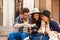 Guy and girl with camera sitting on the bench