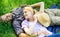 Guy and girl dreamy relaxed enjoy tranquility nature. Couple in love relaxing outdoors. Man unshaven and girl relax on