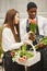 Guy with a girl in a greenhouse with tulips