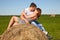 Guy and girl resting on the meadow.