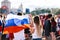 A guy with a girl with a Russian flag on the fan zone during the World Cup