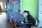 Guy and girl students relax in library after school and sit at t