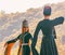 A guy with a girl in traditional Circassian clothes dancing at the festival of Adyghe cheese in the foothills of the Caucasus