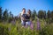 A guy and a girl are walking in the field of lupines