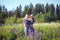 A guy and a girl are walking in the field of lupines