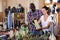 Guy with girlfriend choosing handmade earthenware