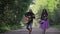 The guy with the guitar and his girlfriend are on a country road. Two lovers traveler with a guitar. Beautiful couple