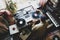 The guy is a hip-hop DJ in a home studio playing records .Hip-hop composer, beatmaker creates rhythms