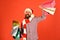 Guy or hipster shopper in red hat with shopping bags