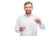 A guy is holding a glass of water and a capsule in his hand on a white isolated background