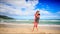 Guy Holds in Arms Circles Kiss Blond Girl on Beach Wave Surf