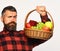 Guy holds homegrown harvest. Farmer with proud face