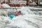 Guy in kayak sails mountain river. Whitewater kayaking, extreme sport rafting