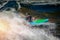 Guy in kayak sails mountain river. Whitewater kayaking, extreme sport rafting