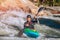 Guy in kayak sails mountain river. Whitewater kayaking, extreme sport rafting