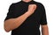 Guy keeps arm on breast near heart with fist. Gesture of man in black t-shirt isolated with no face. Concept of vigor and