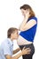Guy kisses a girl pregnant abdomen