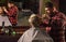 Guy with long dyed blond hair close up rear view. Cut hair. Barber making hairstyle for bearded man barbershop