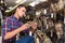 guy looking holster for pneumatic weapon in army store