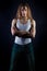 Guy male model with long hair posing in Studio on black background and a white t-shirt and jeans