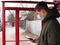 Guy in a medical mask stands at a bus stop. isolated to avoid viral disease covid-19 measles flu chickenpox cold