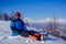 A guy on a mountain overlooking the volcanoes of Kamchatka