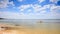 Guy Paddles Kayak along Shallow Transparent Sea