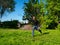 Guy play badminton outdoors on a beautiful summer day