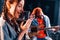 Guy plays guitar, girl sings. African american man with white girl rehearsing in the studio together