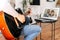 Guy plays guitar to parents via video call