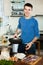 Guy preparing skillet for calamary