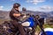 Guy riding a retro cruiser motorcycle on mountain road in South tyrol enjoying the beautiful view