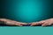 The guy `s hands lies with left and right on a barbed massage mat on an ocean background. side view. healthy lifestyle. Thematic