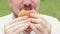 The guy\\\'s mouth bites a big burger close-up