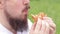 The guy\\\'s mouth bites a big burger close-up