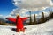 A guy snowboarder enjoys a holiday at the ski resort